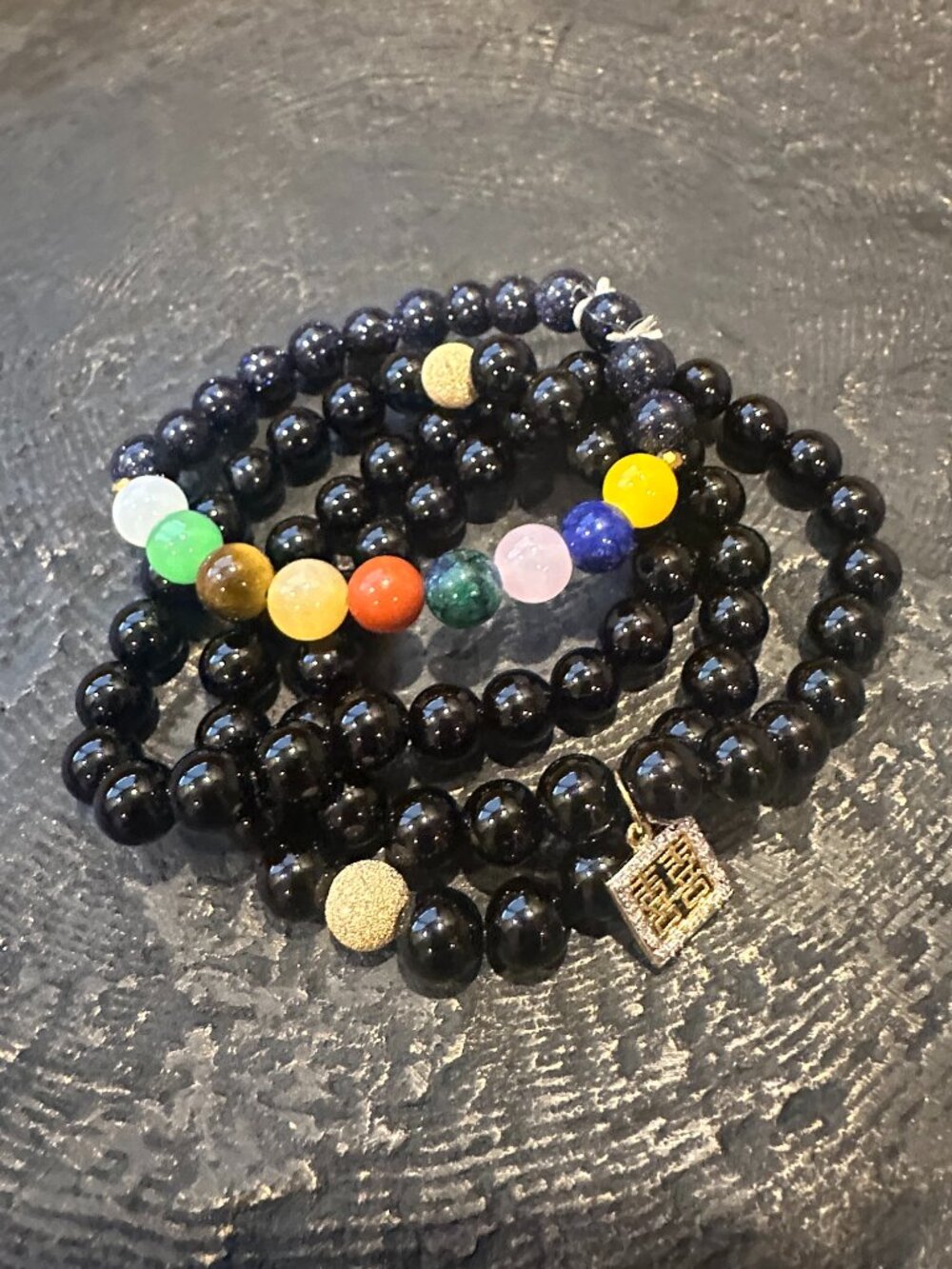 NWOT CELESTIAL BLACK BEAD AND CHARM BRACELET SET OF FOUR